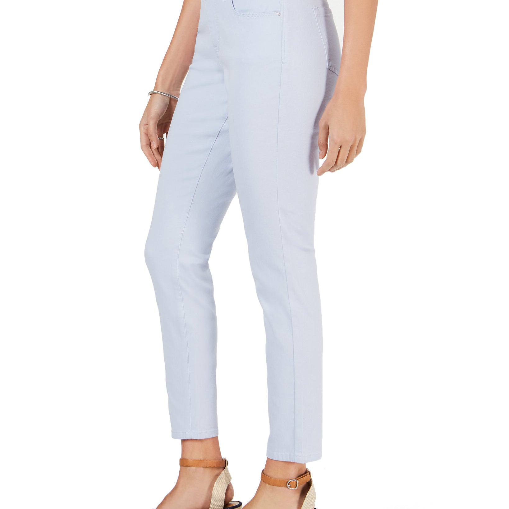 Light blue jeans worn by a person on a white background