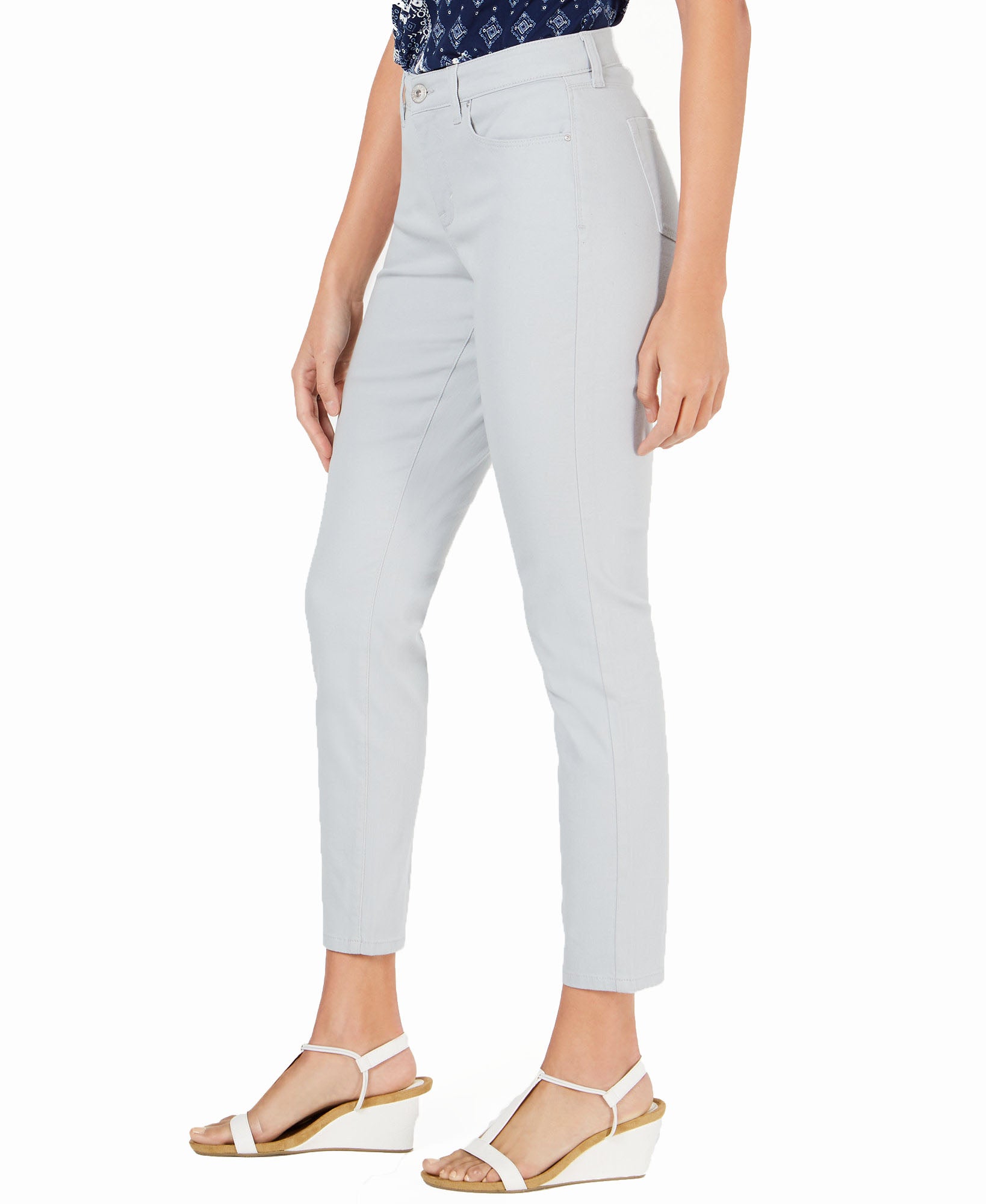 Light gray pants worn by a person on a white background
