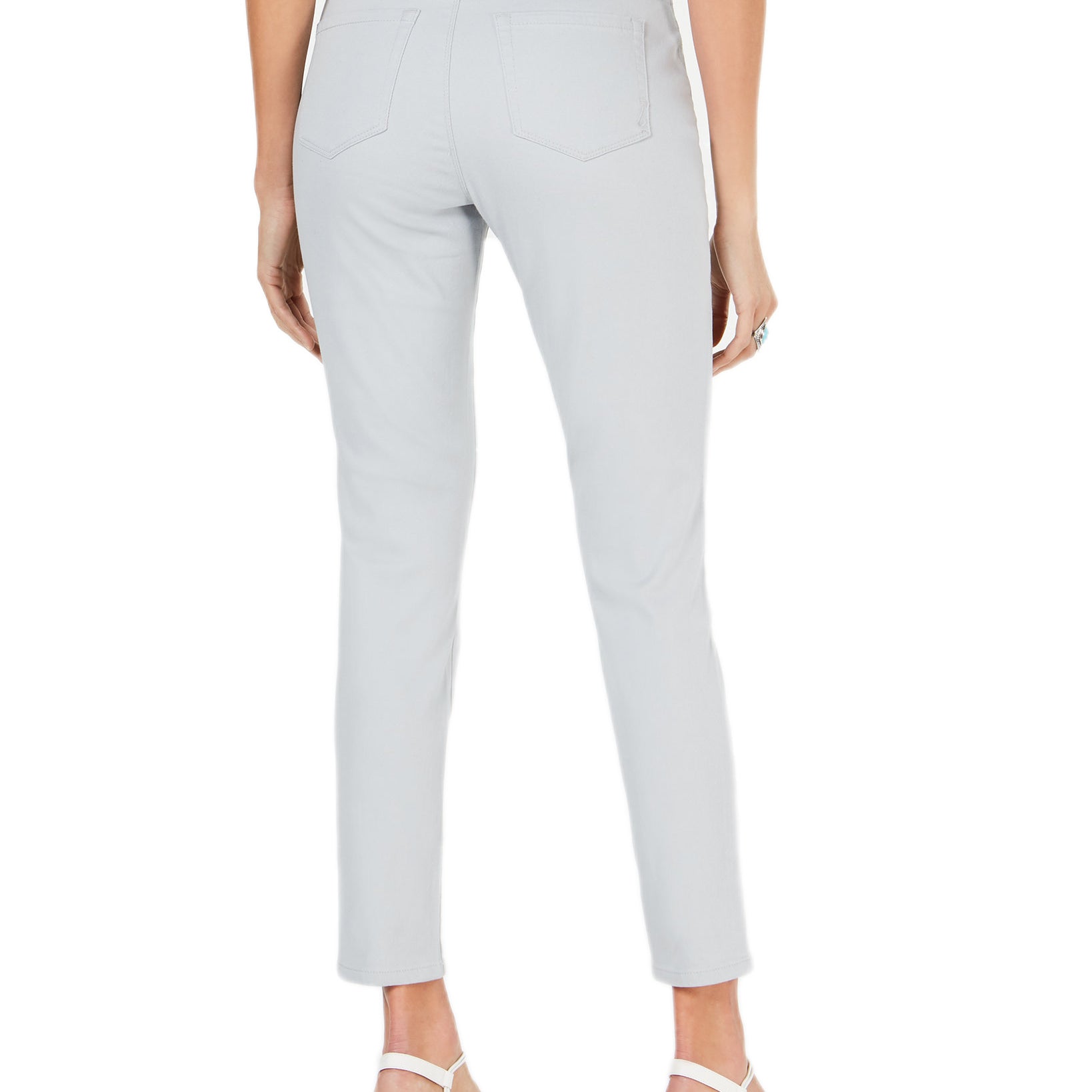 Light gray pants worn by a person on a white background
