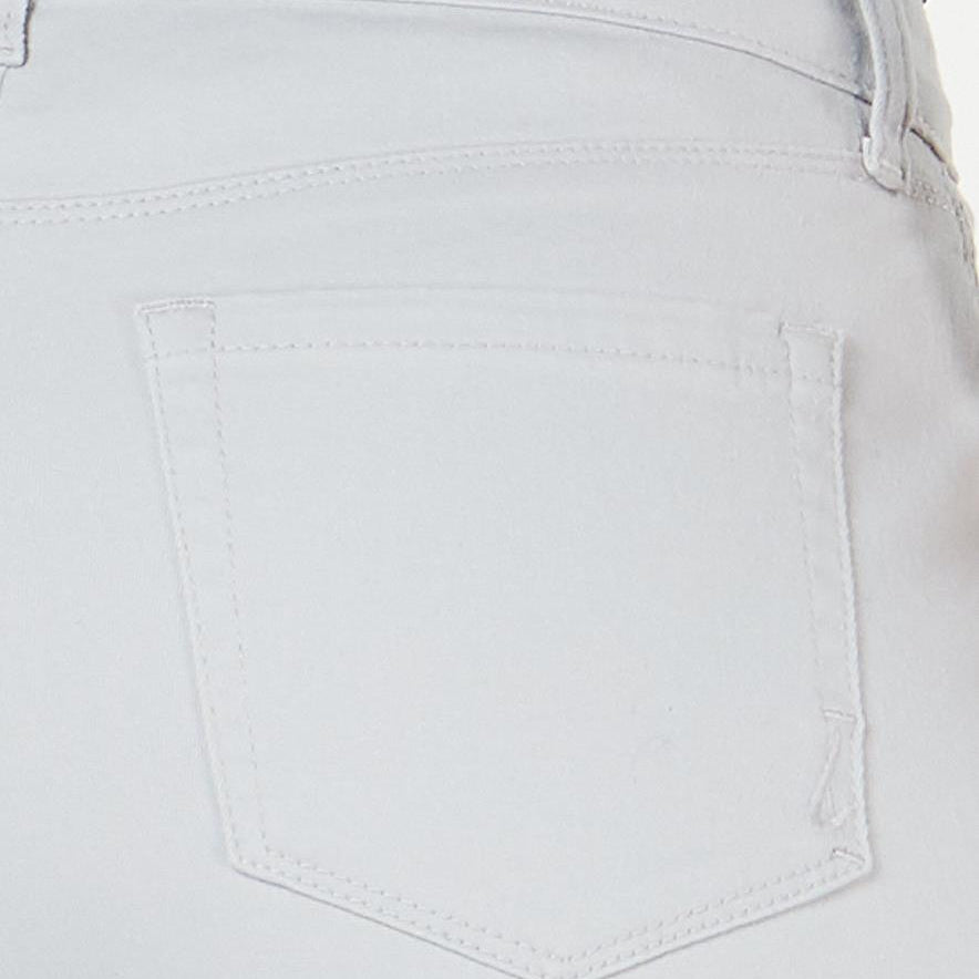 Close-up of light gray pants with a pocket detail on a white background
