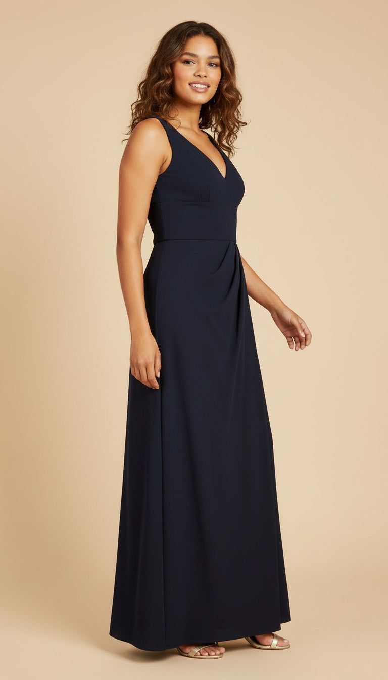 Woman wearing a navy blue sleeveless gown on a beige background