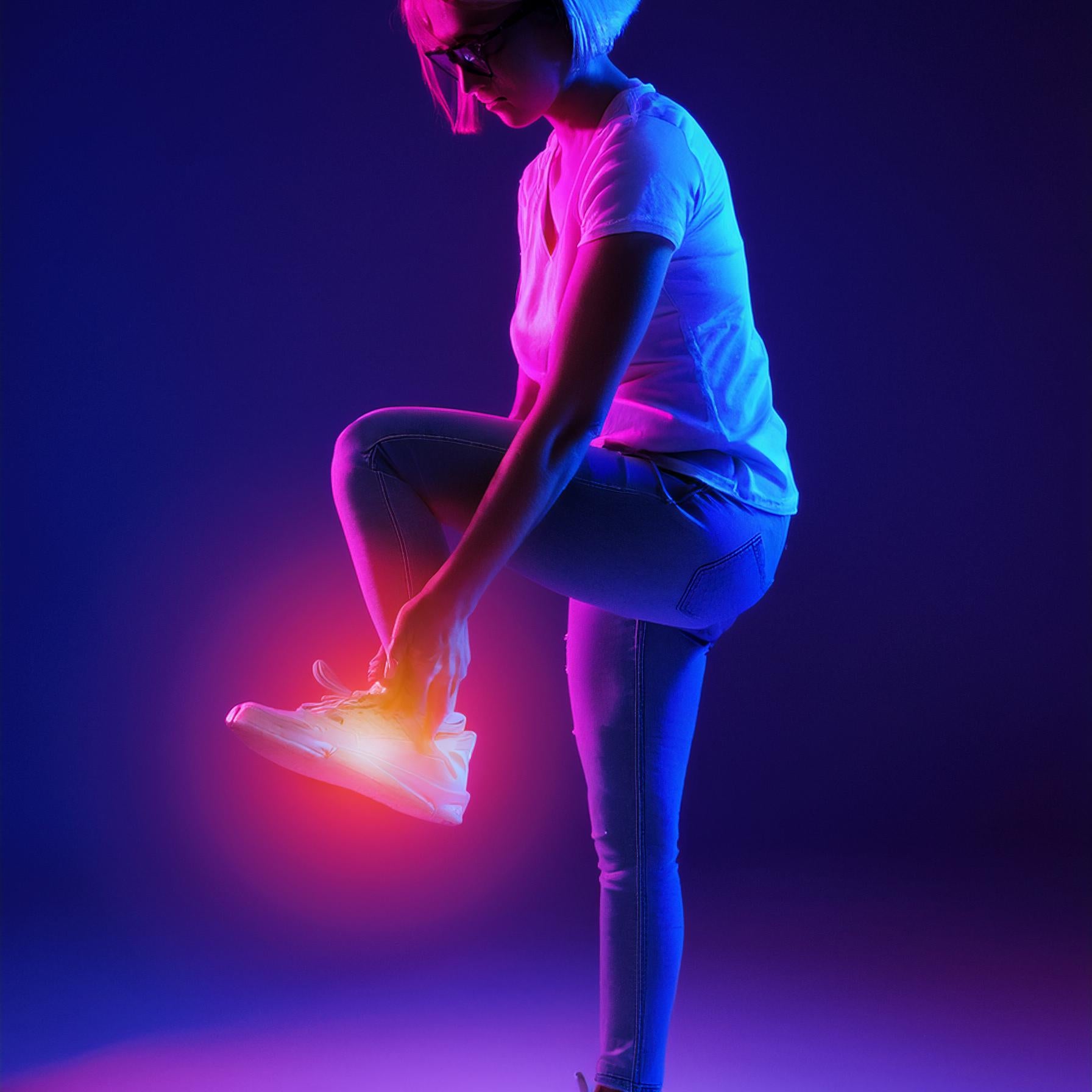 Women standing suffering foot pain