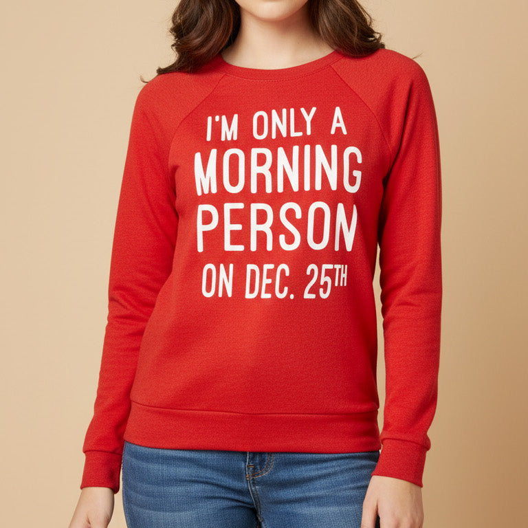 Person wearing a red sweatshirt with holiday text on a beige background