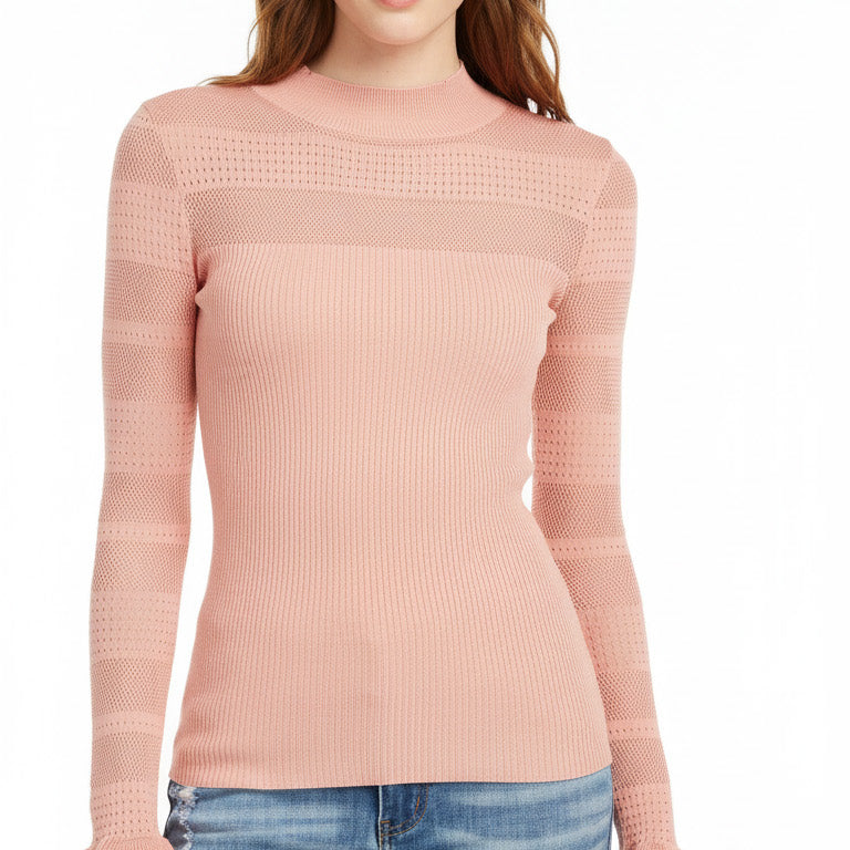 Woman wearing a pink sweater and blue jeans on a white background