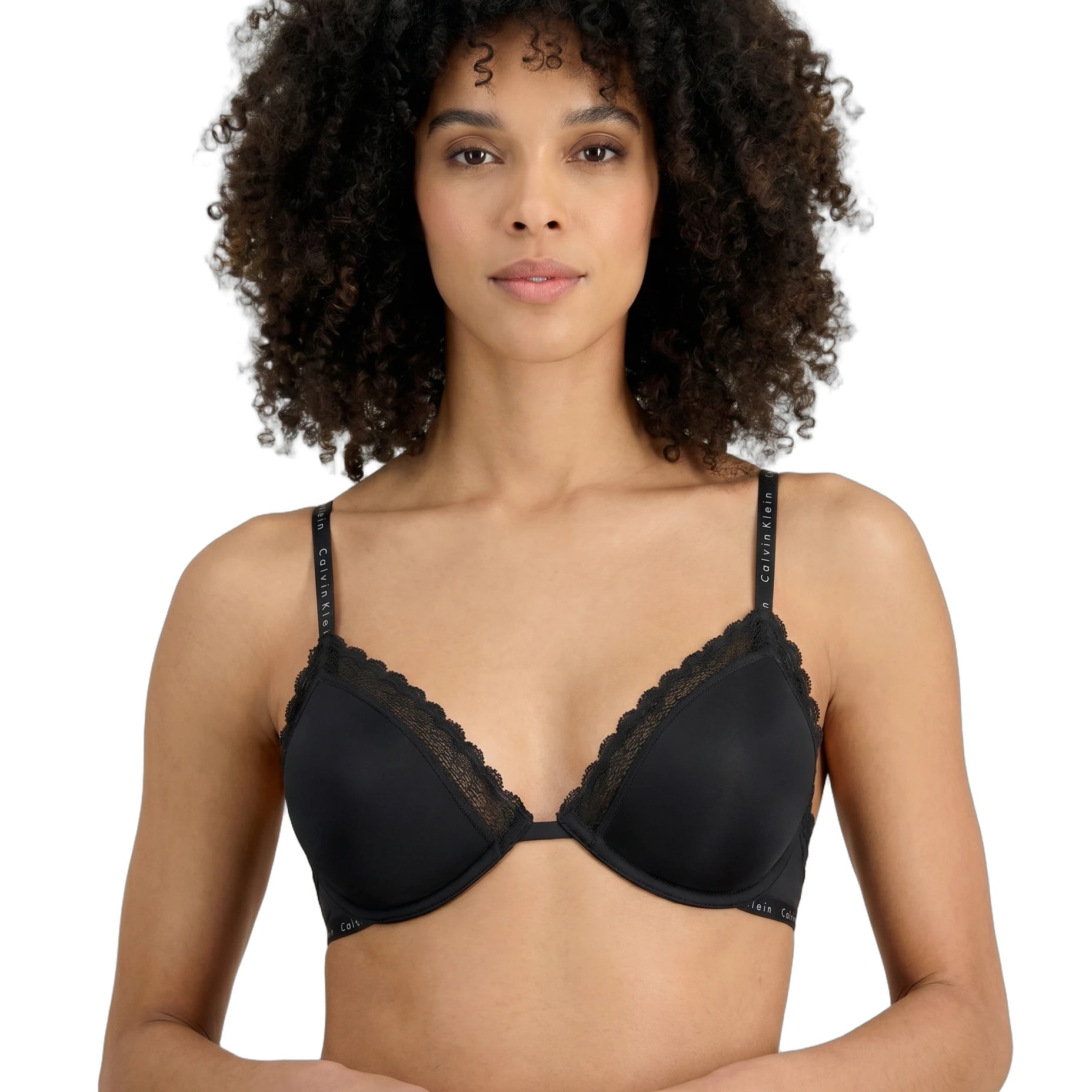 Woman wearing a black Calvin Klein bra on a white background