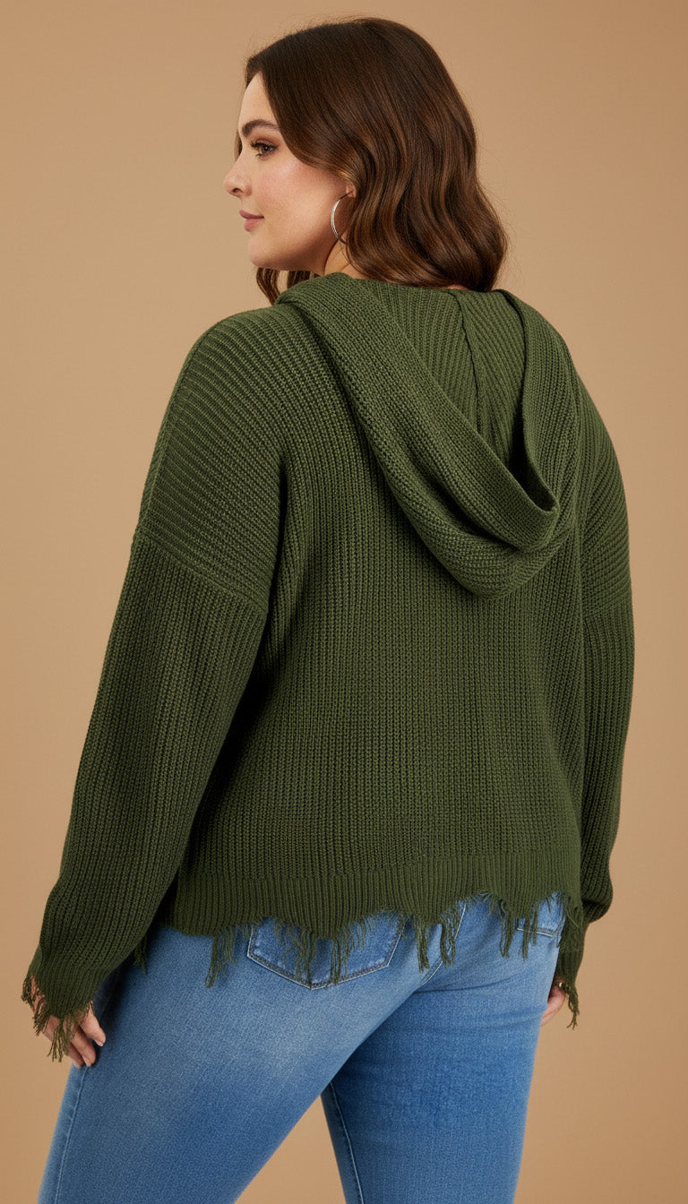 Woman wearing a green hoodie and blue jeans on a beige background
