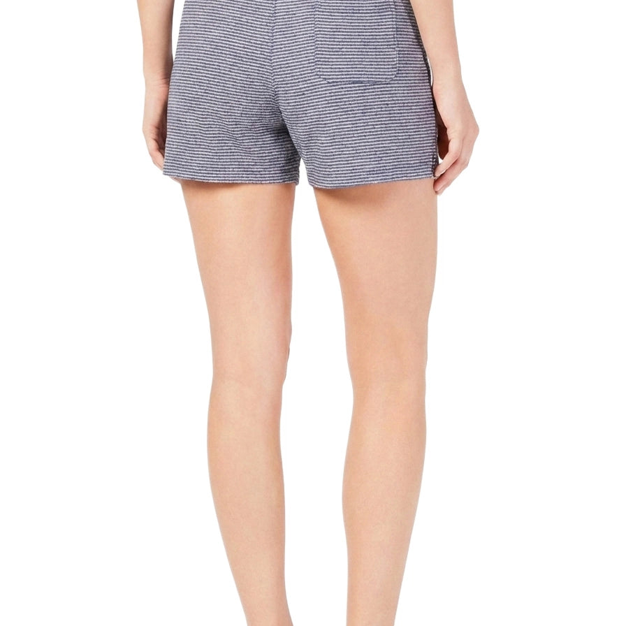 Person wearing blue striped shorts on a white background