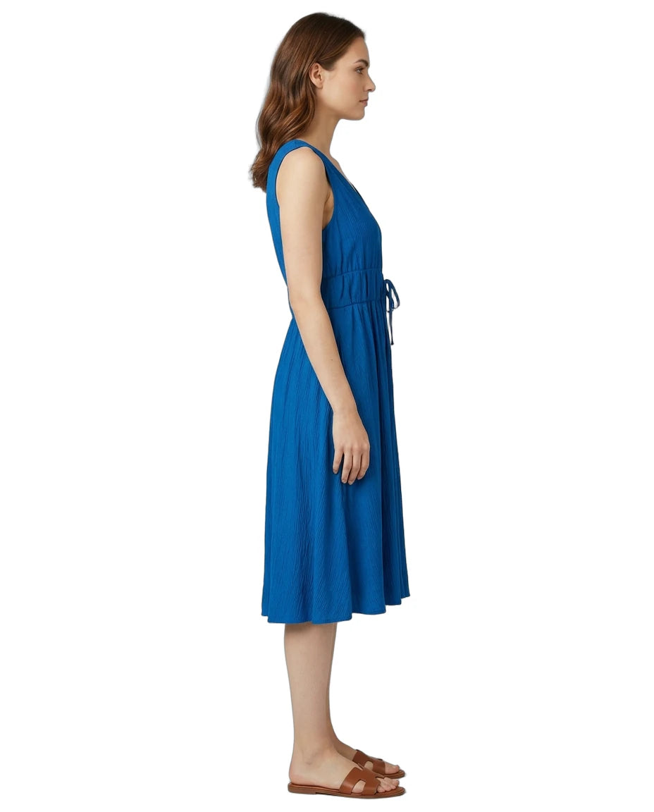 Woman wearing a blue dress on a white background
