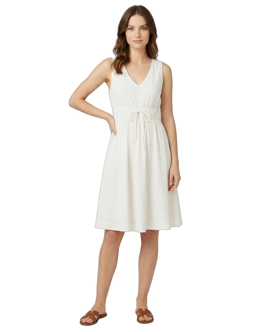 Woman wearing a white dress on a white background