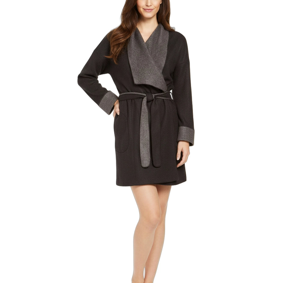 Woman wearing a black and gray robe on a white background