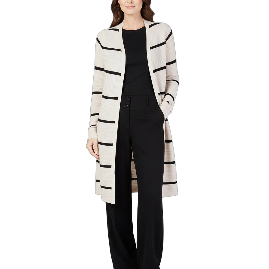 Woman wearing a long, striped cardigan over a black outfit on a white background