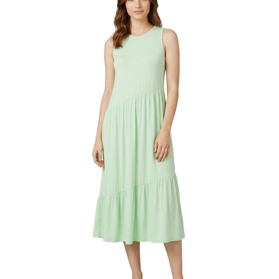 Woman wearing a light green dress on a white background
