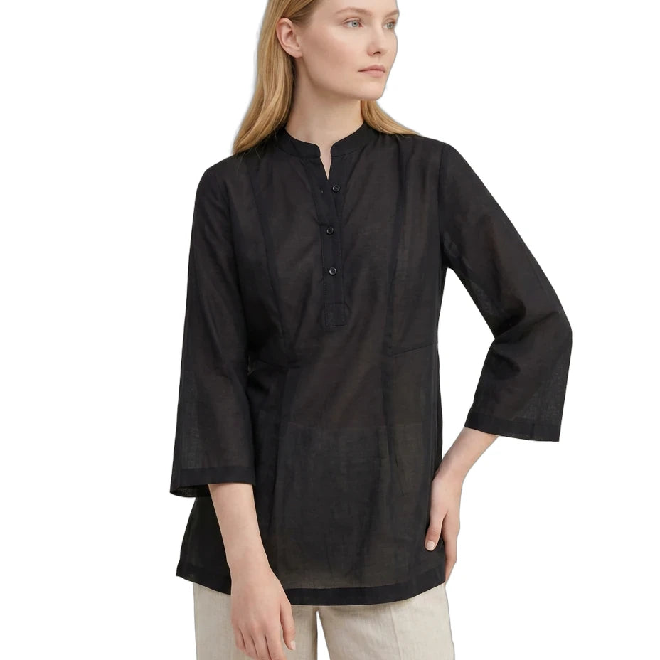 Woman wearing a black long-sleeve shirt on a white background