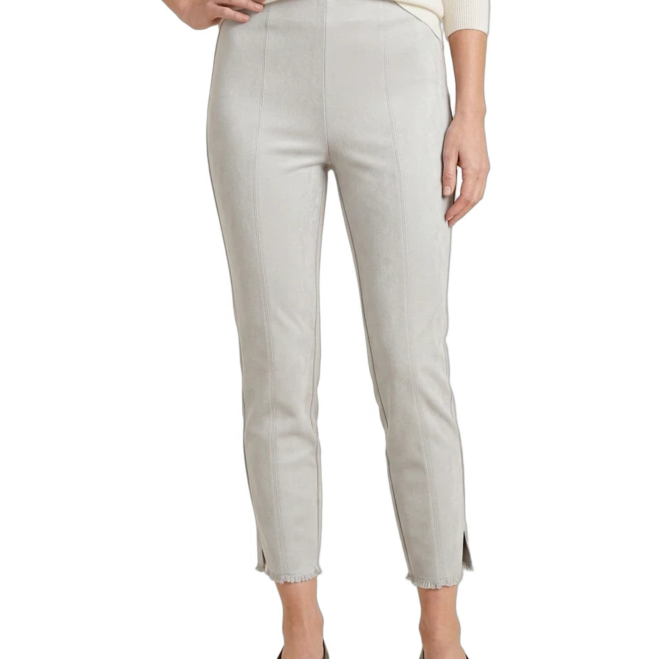 A model wearing light beige cropped trousers with side slits, paired with a cream long-sleeve top and black flats, shown against a plain white background.