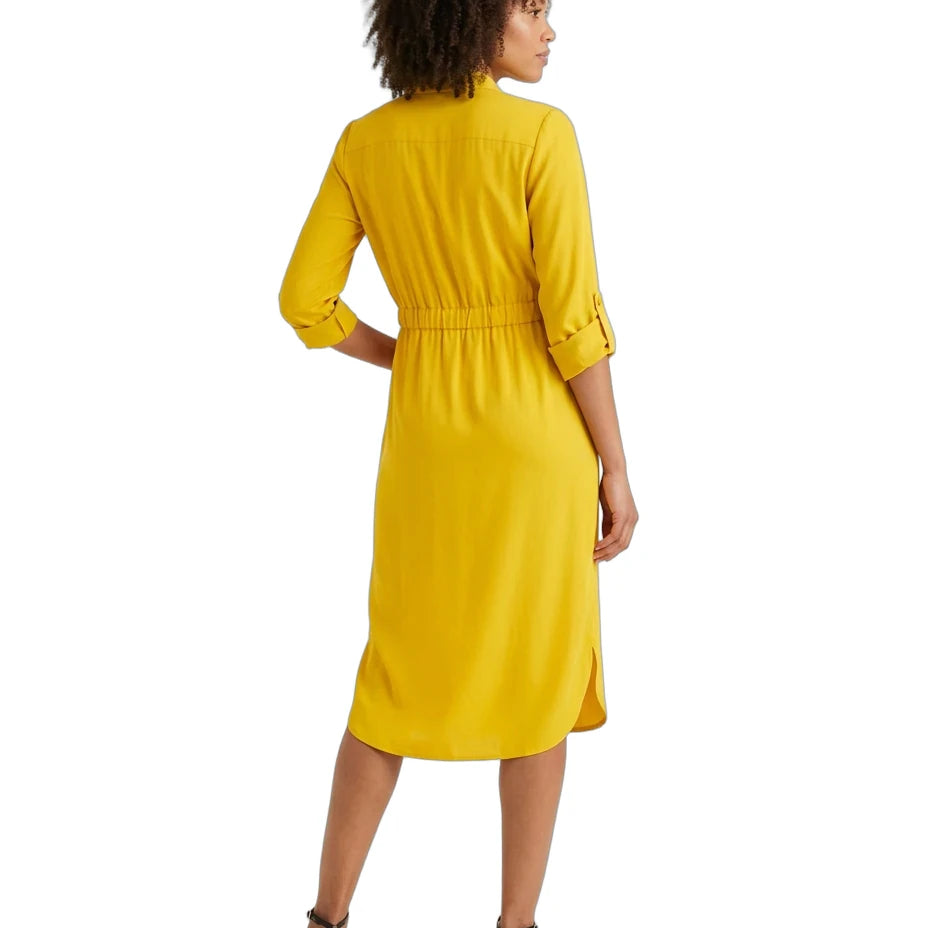 A woman wearing a bright yellow midi shirt dress, shown from the back. The dress features three-quarter sleeves with button details at the cuffs, a high mock neck, and a gathered elastic waist.