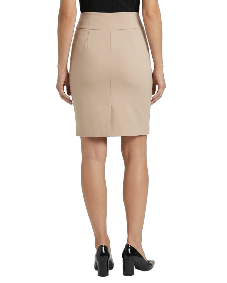 A woman shown from the back wearing a beige knee-length pencil skirt with a front center seam, paired with a black top and black patent leather block heels, against a plain white background.