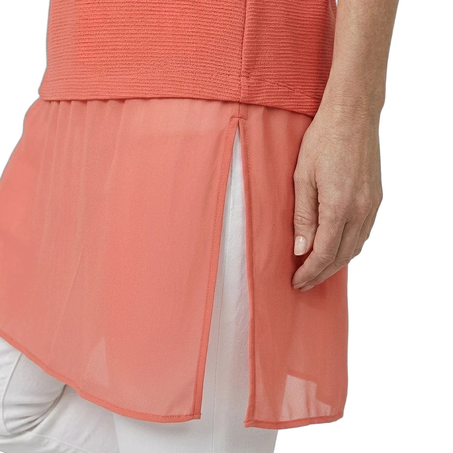 Coral layered dress with sheer overlay on a white background