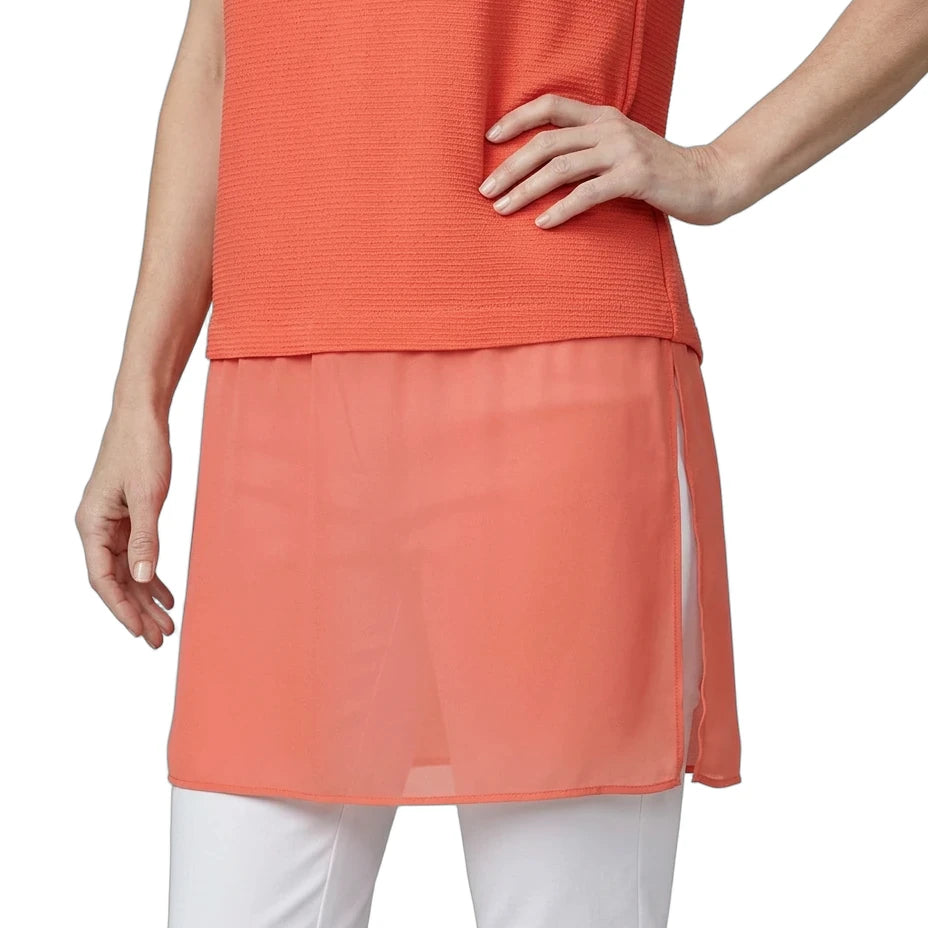 Coral sleeveless top and skirt with white pants on a plain background