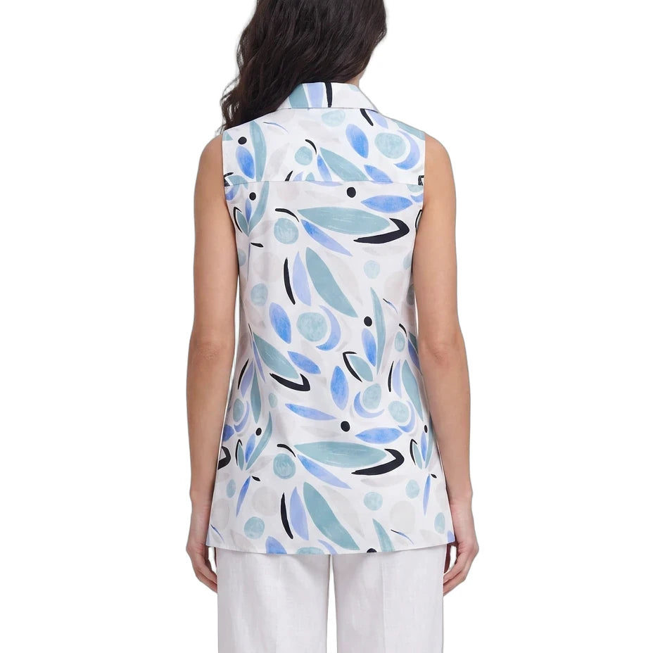 Woman wearing a sleeveless top with abstract blue and black design on a white background