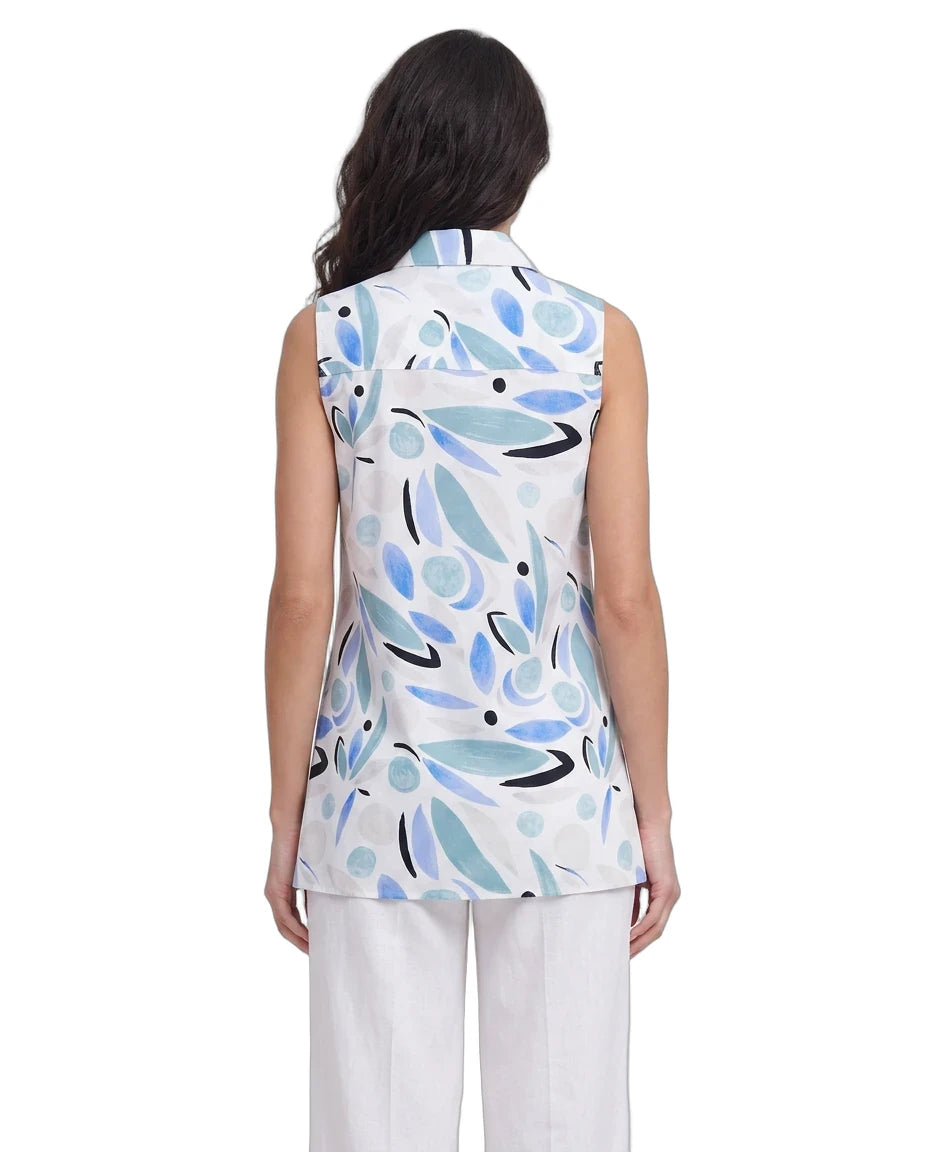 Woman wearing a sleeveless top with abstract blue and black design on a white background