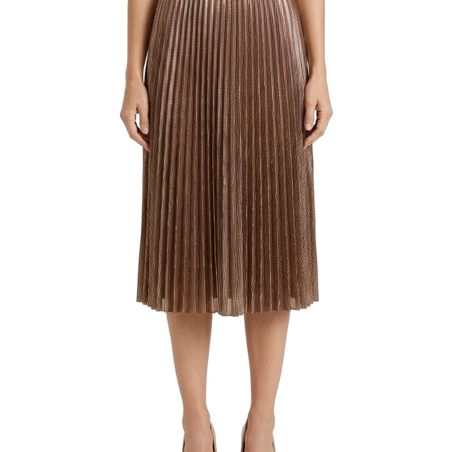 A model wearing a metallic bronze pleated midi skirt with a black waistband, paired with beige heels, shown against a plain white background.