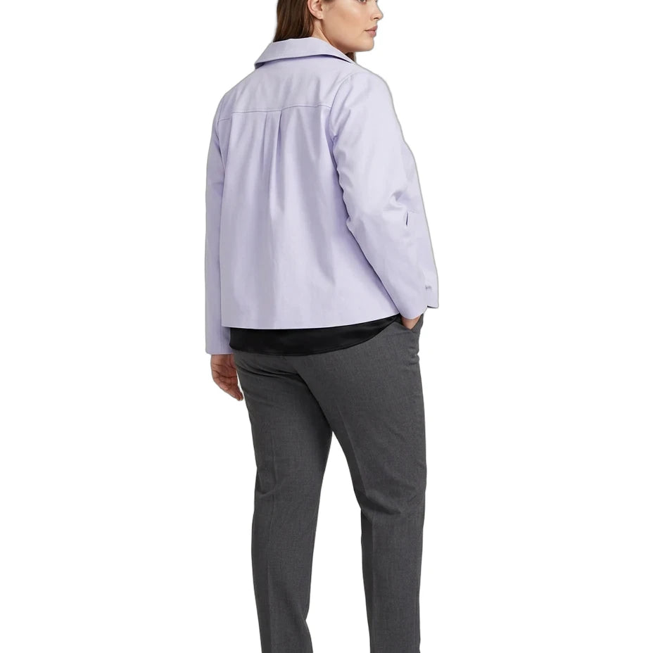 A woman shown from the back wearing a light lavender button-up shirt, dark gray trousers, and white sneakers against a plain white background.