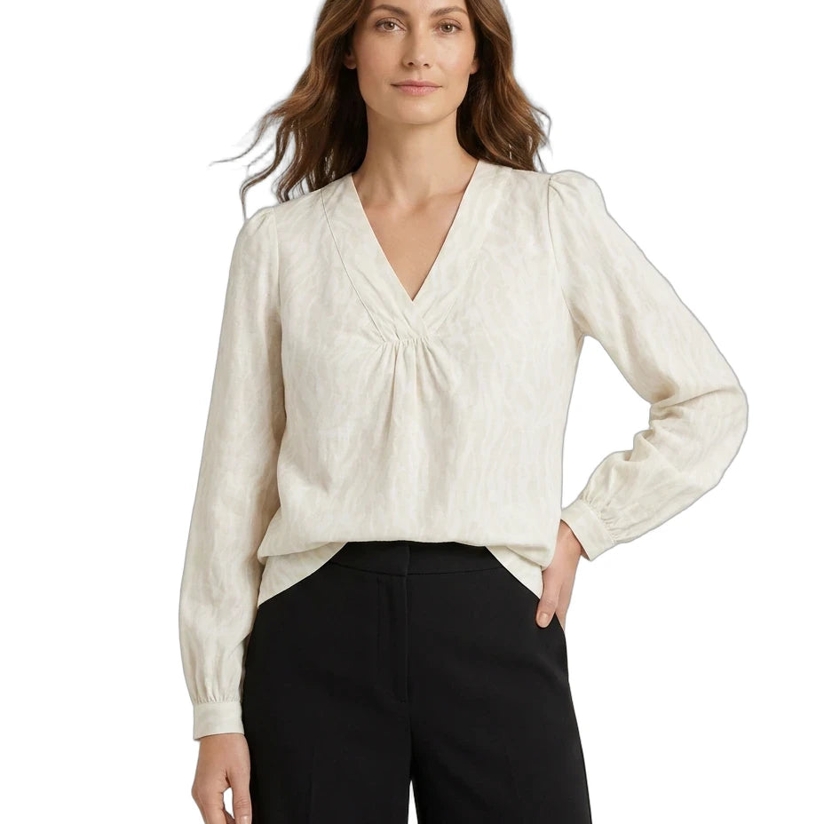 Woman wearing a white blouse with long sleeves on a white background