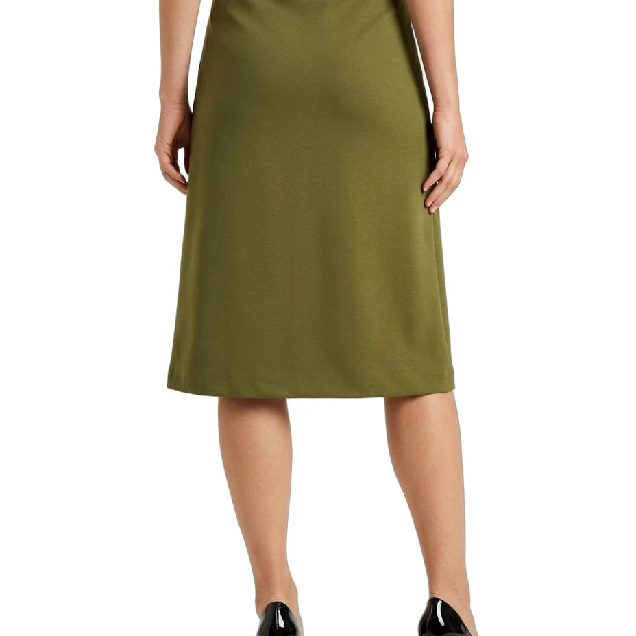 An olive green knee-length A-line skirt with an elastic waistband, shown on a model from the back wearing black patent high heels against a white background.