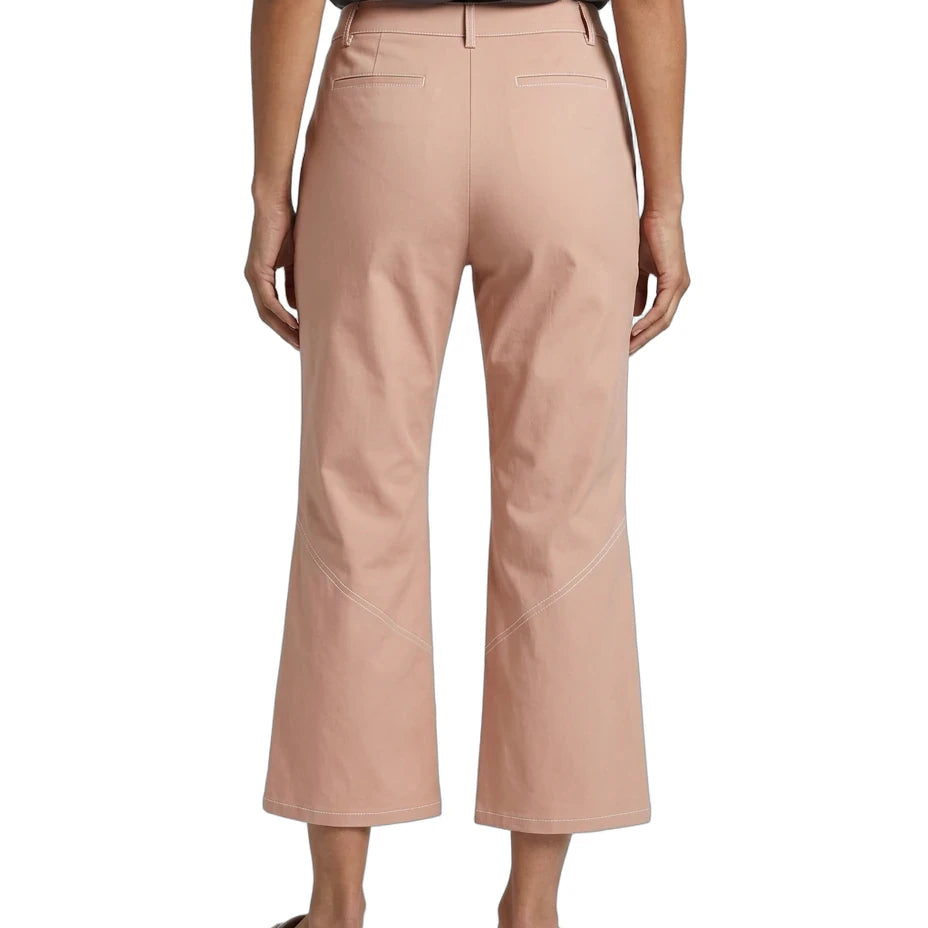 A model shown from the back wearing dusty rose cropped trousers, a dark gray top, and white slide sandals against a plain white background.