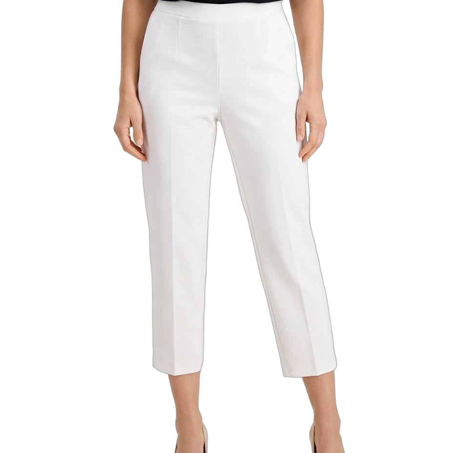 White cropped ankle-length pants shown on a model against a plain white studio background. The model is also wearing a black top and beige heels.