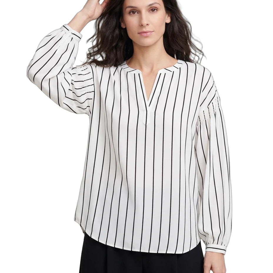 Woman wearing a black and white striped shirt on a white background