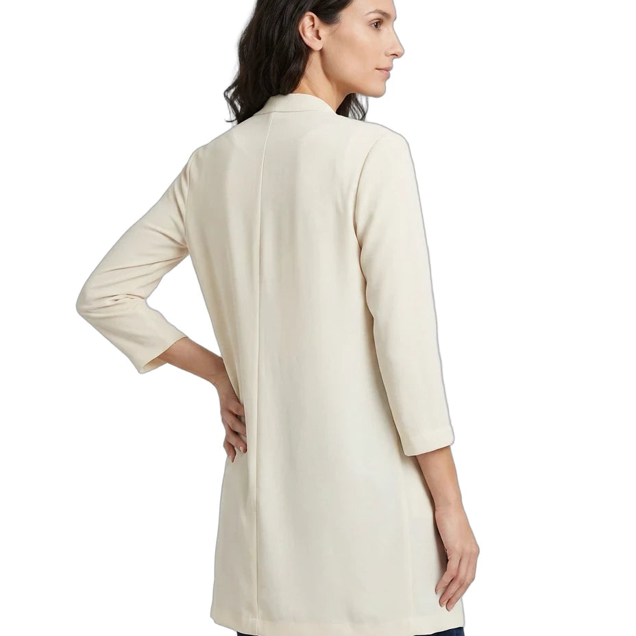 Woman wearing a beige cardigan on a white background