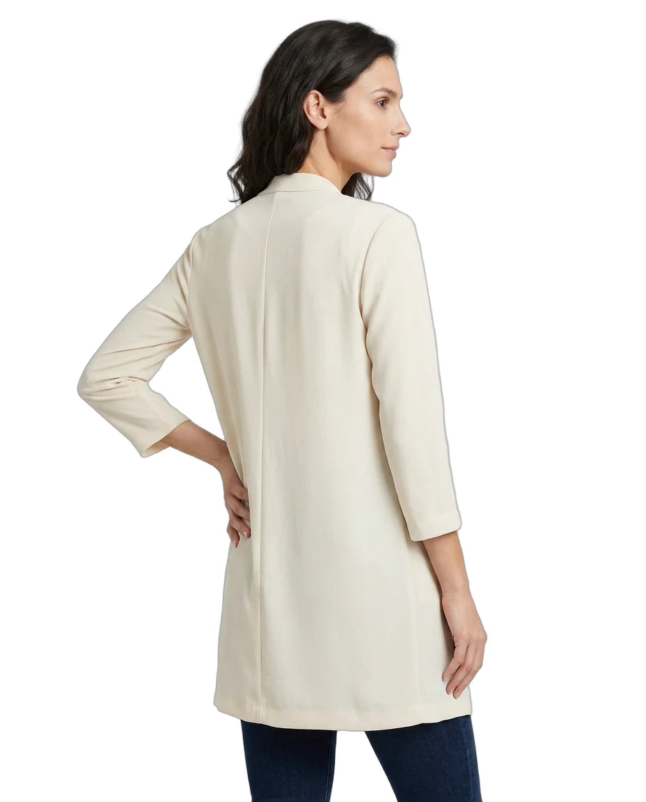 Woman wearing a beige cardigan on a white background