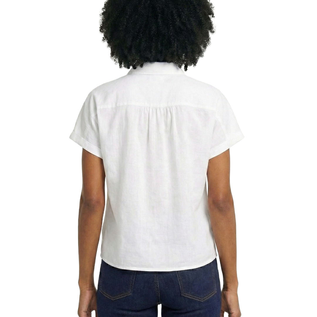 Person wearing a white blouse and dark blue jeans on a white background