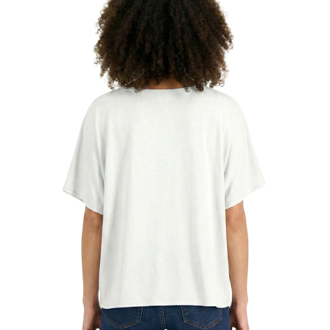 Person wearing a white t-shirt and blue jeans on a white background