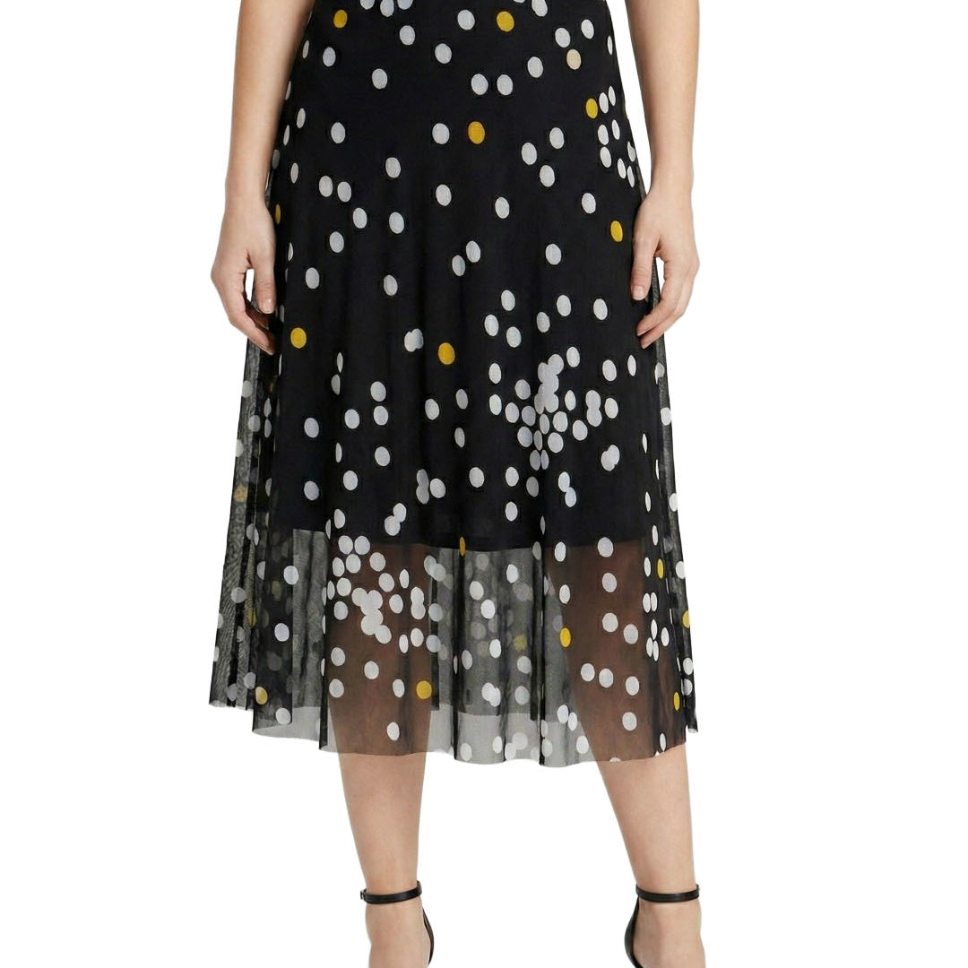 Black skirt with white and yellow polka dots on a white background