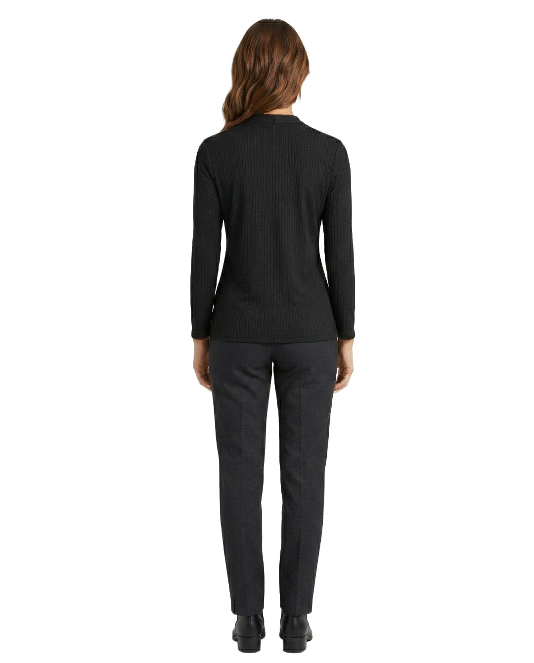 Person wearing a black long-sleeve top and gray pants on a white background