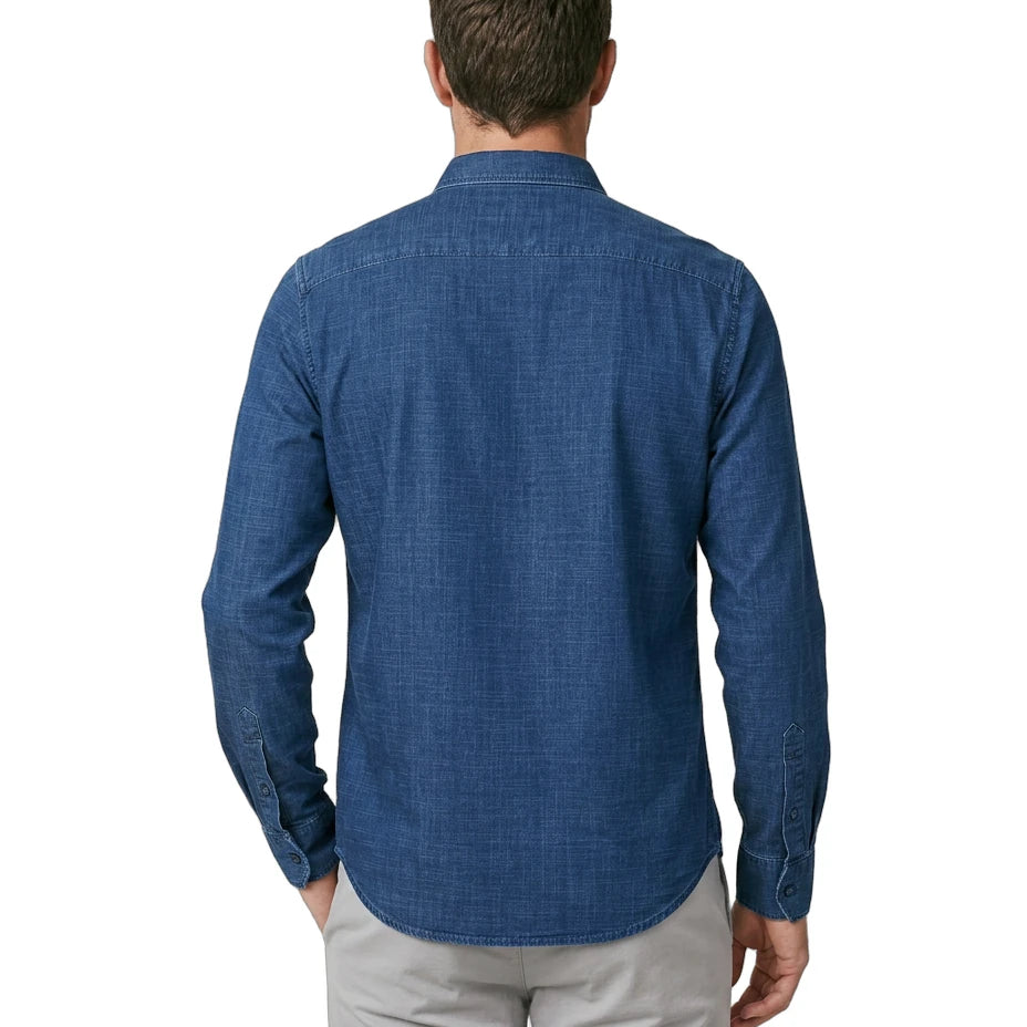Man wearing a blue patterned shirt on a white background