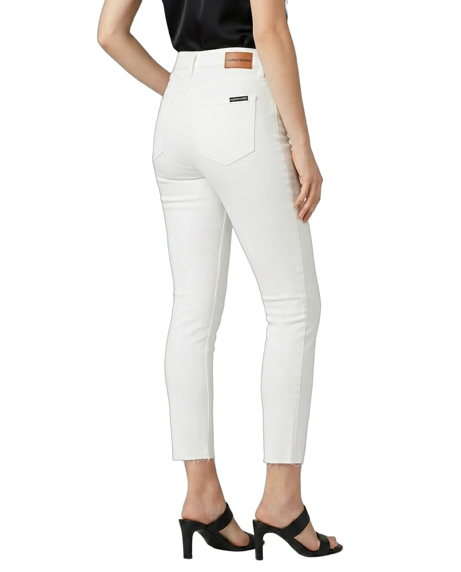 White pants worn by a person on a white background