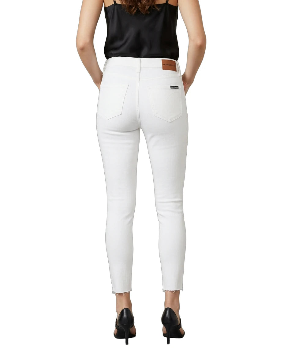Person wearing white pants with a black top on a white background