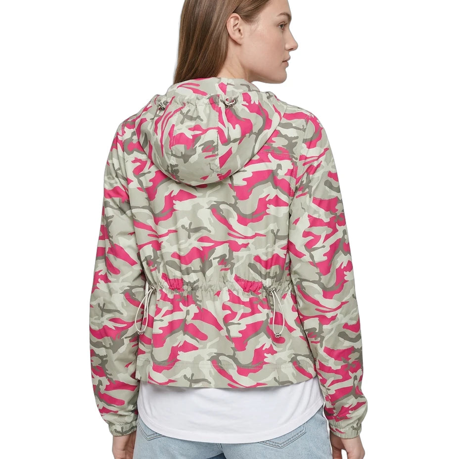 Woman wearing a pink and green camouflage jacket on a white background