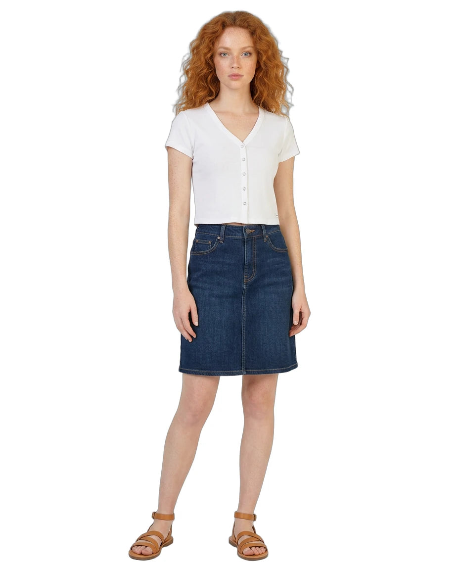 Woman wearing a white shirt and blue denim skirt on a white background