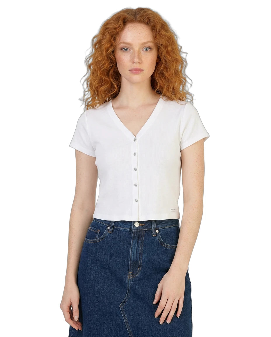 Woman wearing a white short-sleeve blouse and blue jeans on a white background