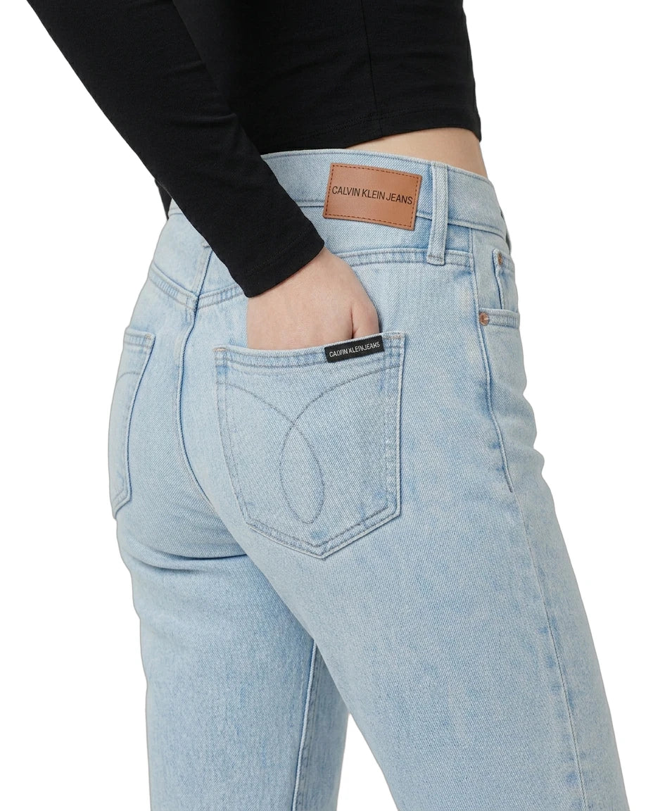 Light blue jeans with a Calvin Klein label on a white background