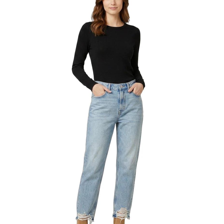 Woman wearing a black top and light blue jeans on a white background