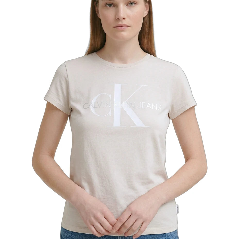 Woman wearing a beige t-shirt with a logo on a white background