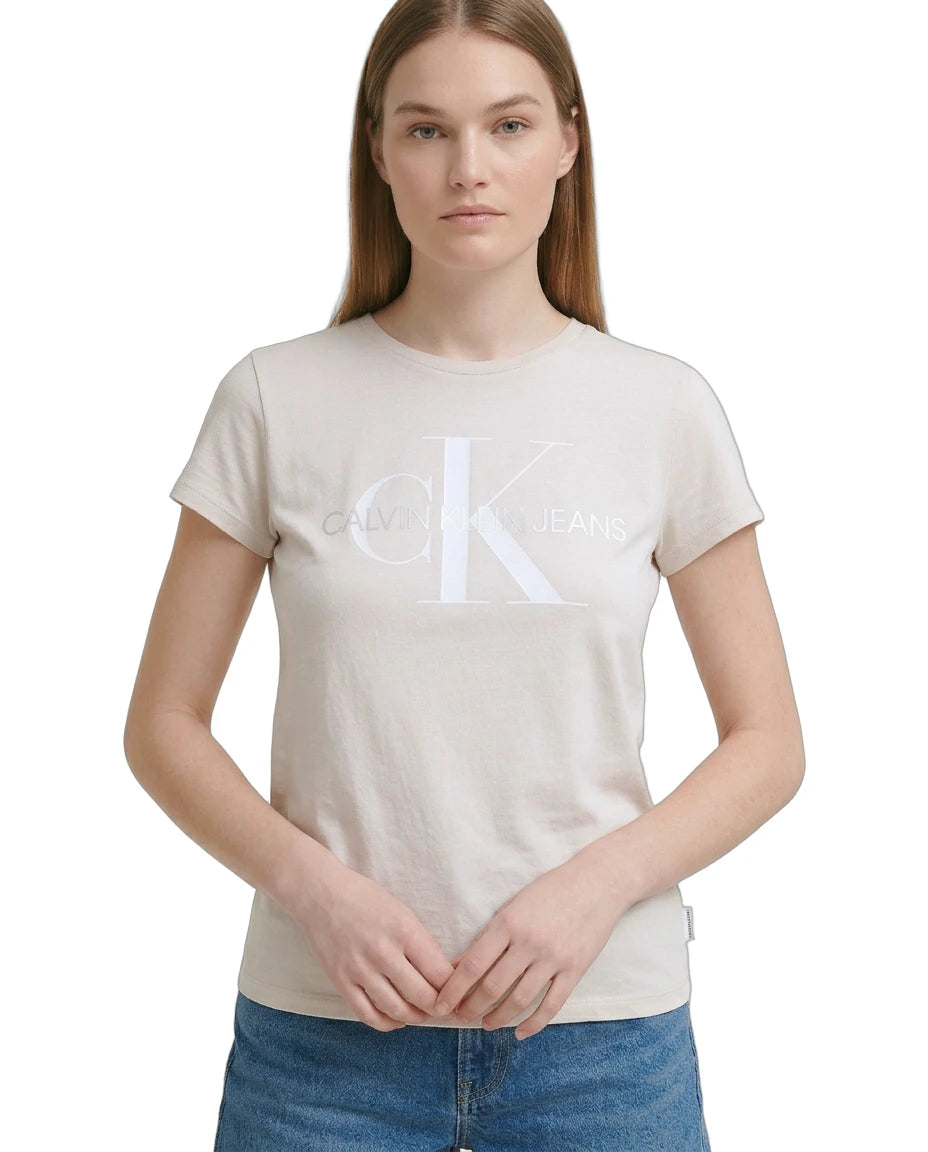 Woman wearing a beige t-shirt with a logo on a white background