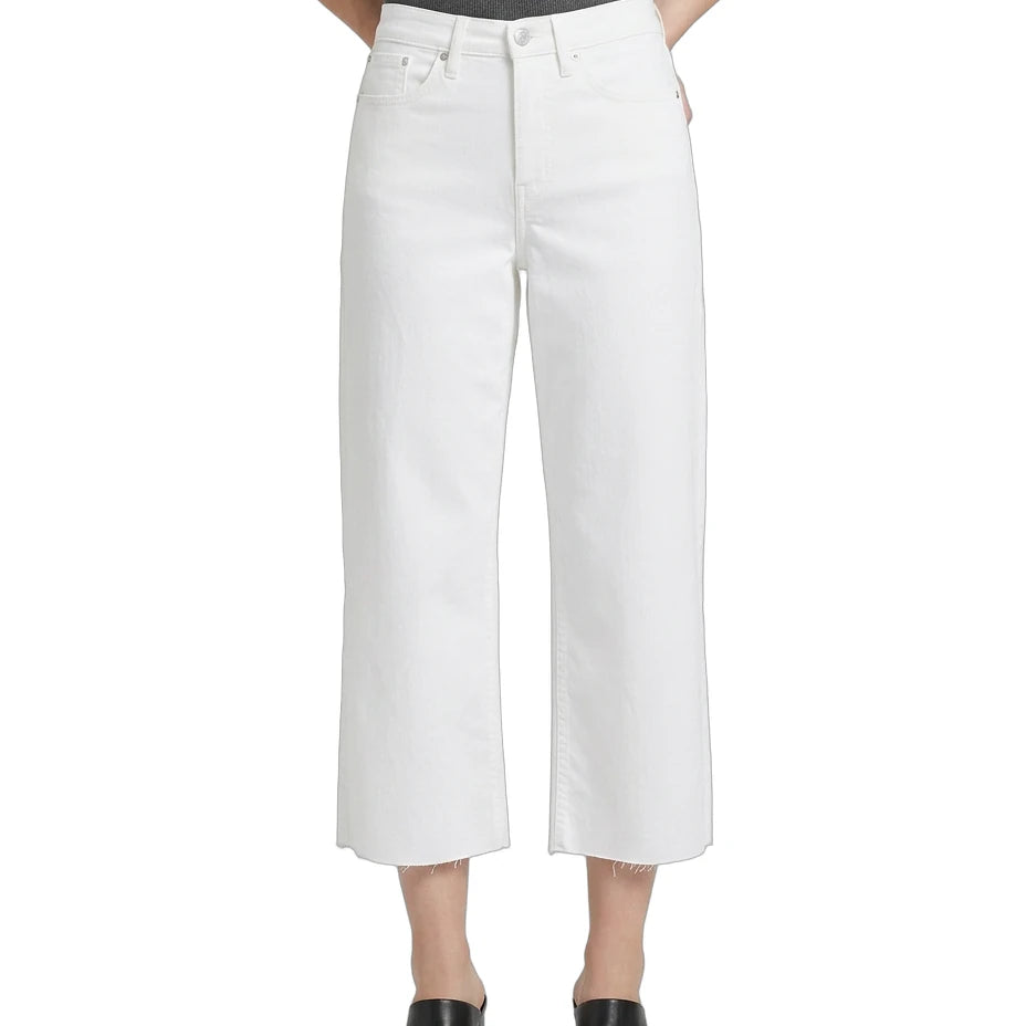 Person wearing white wide-leg jeans on a white background