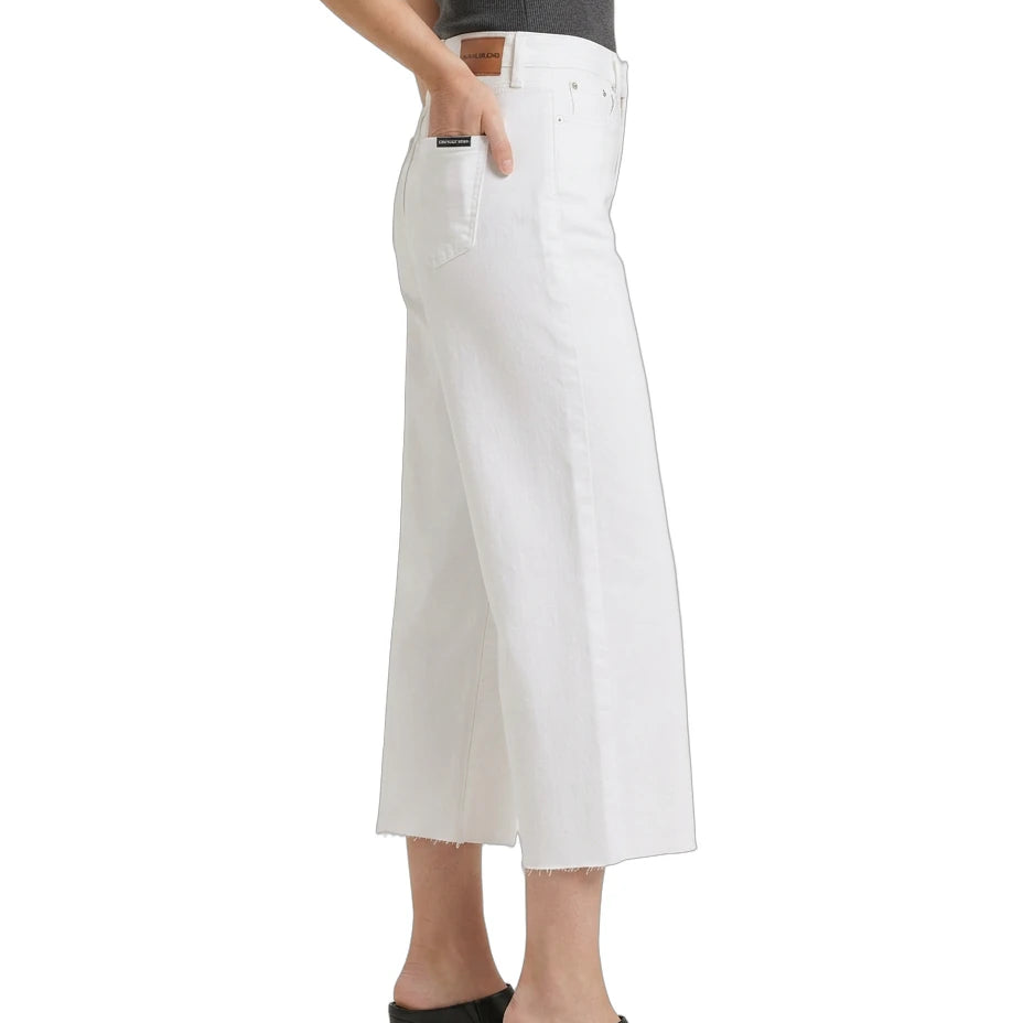 White wide-leg jeans worn by a person on a white background