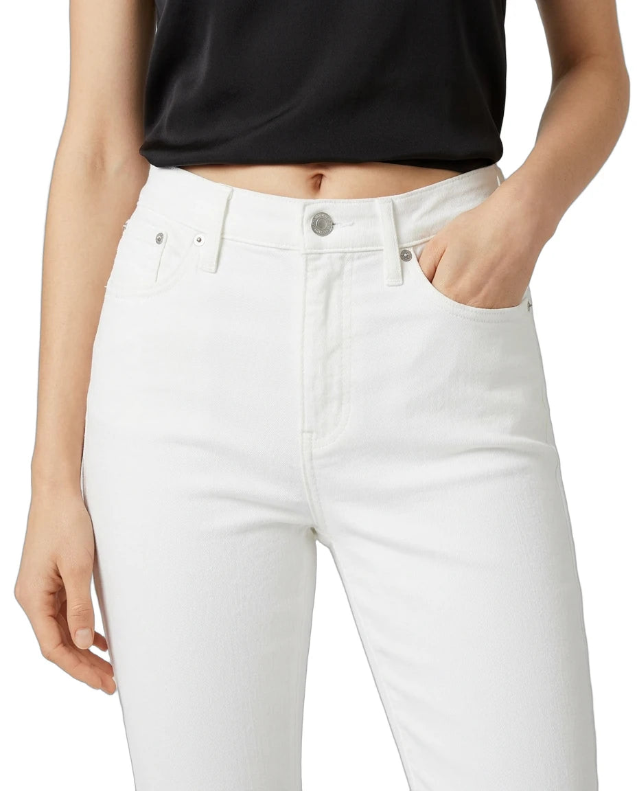 Person wearing white jeans and a black top on a plain background